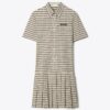 Golfkleid mit Karomuster, tiefem Taillenbund und Falten Golfkleid mit Karomuster, tiefem Taillenbund und Falten