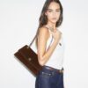 Kira Turnlock Schultertasche aus Wildleder Kira Turnlock Schultertasche aus Wildleder