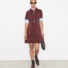 Kurzärmeliges Golfkleid mit Ziernähten Kurzärmeliges Golfkleid mit Ziernähten